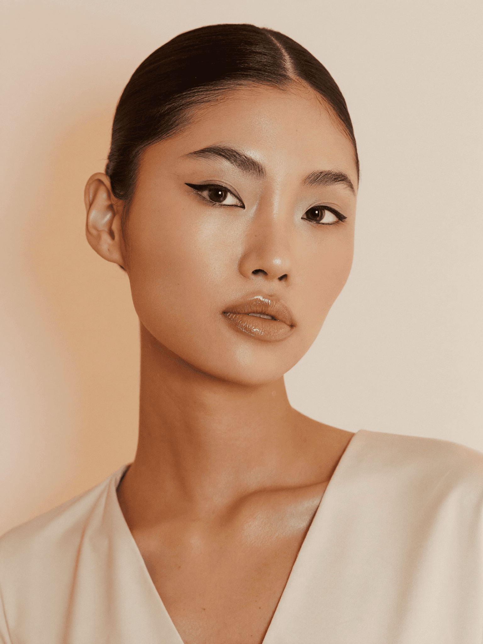 Radiant Asian woman with elegant editorial makeup